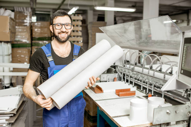istock Worker portrait with paper tubes 923431224
