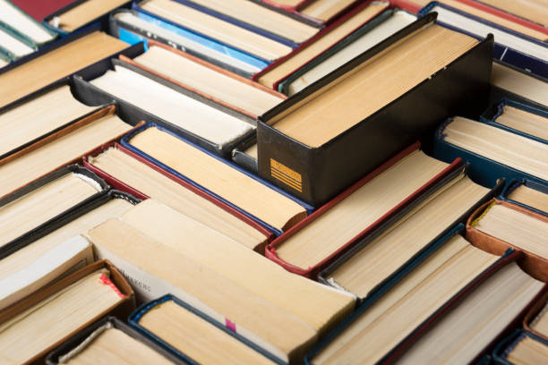 istock Stack of books background. many books piles. 923433542