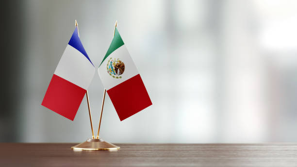 istock French And Mexican Flag Pair On A Desk Over Defocused Background 923434490