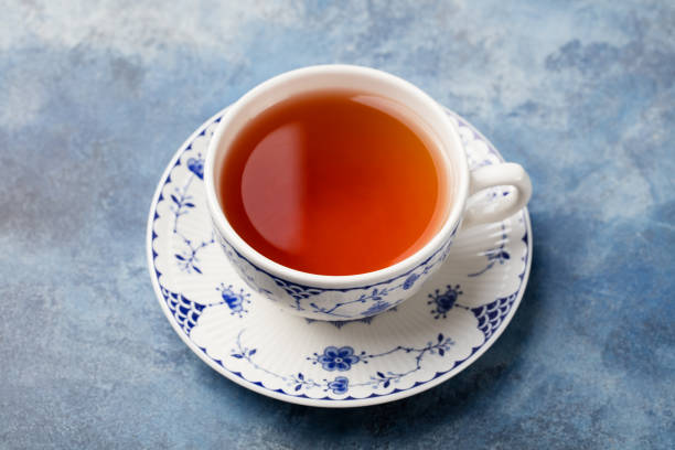istock Cup of tea on a blue stone background. 923434702