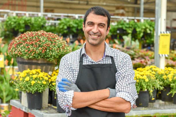 istock Male Florist working at a plant nursery 923435808
