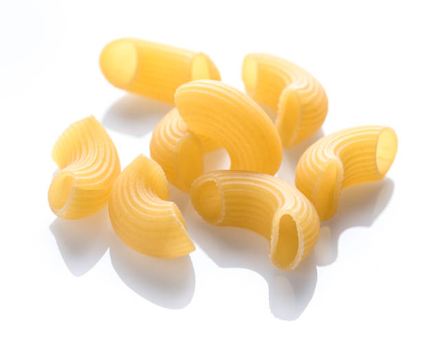 istock Macaroni pasta close up isolated on white background 923438502