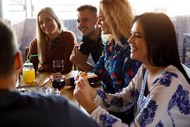 istock Colleagues enjoying pizza together 923438578