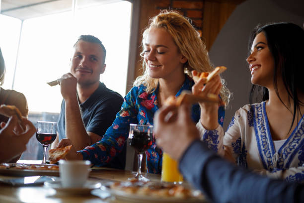istock Colleagues enjoying pizza together 923438584
