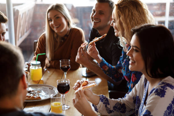 istock Friends enjoying pizza together 923438664