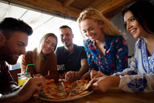 istock Friends enjoying pizza together 923438740