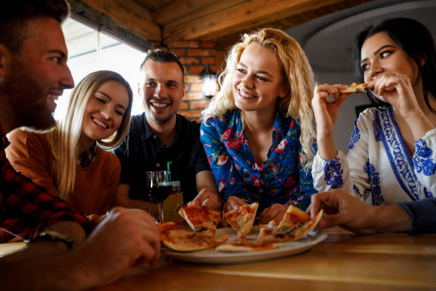 istock Friends enjoying pizza together 923438910