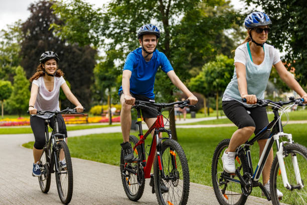 istock Urban biking- three people riding bikes in city 923441840