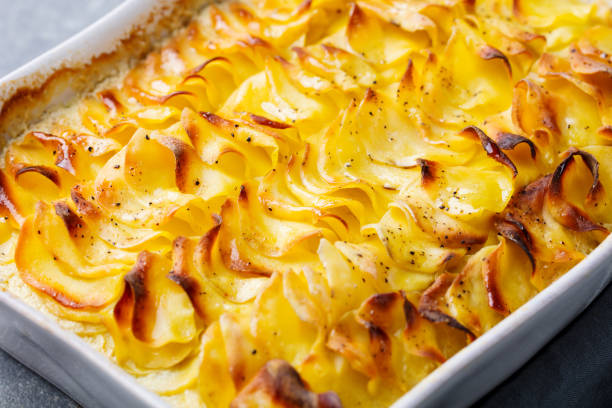 istock Potato gratin, backed potato slices with creamy sauce. 923441876