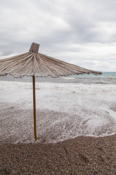 Beach umbrellas from the reed on the beach Jazz. Montenegro.