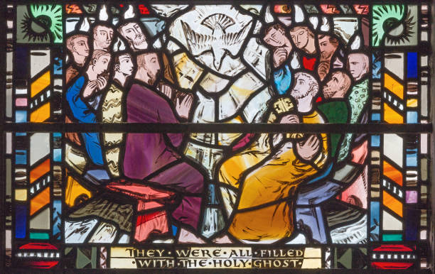 London - The scene of Pentecost on the stained glass in church St Etheldreda by Charles Blakeman (1953 - 1953). London - The scene of Pentecost on the stained glass in church St Etheldreda by Charles Blakeman (1953 - 1953). pentecost religious celebration photos stock pictures, royalty-free photos & images