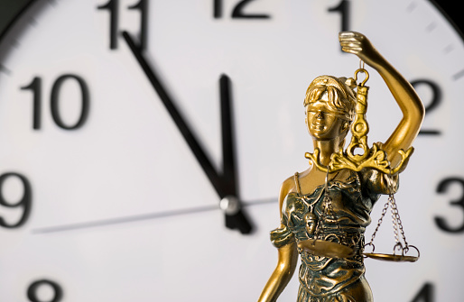 Clock and lady justice.
