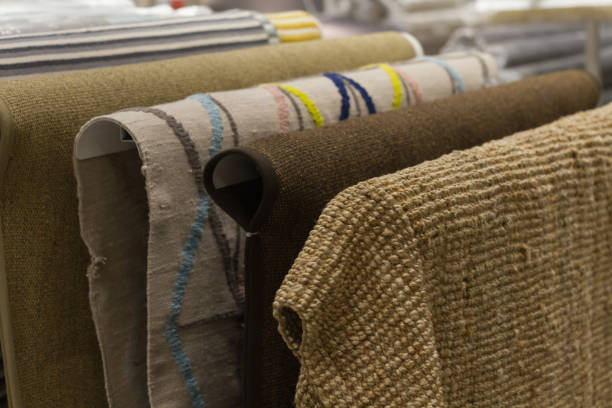 istock New carpets hang in the mall. Selection of carpets 923455552