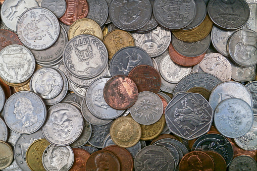 Close-up on a stack of international coins.