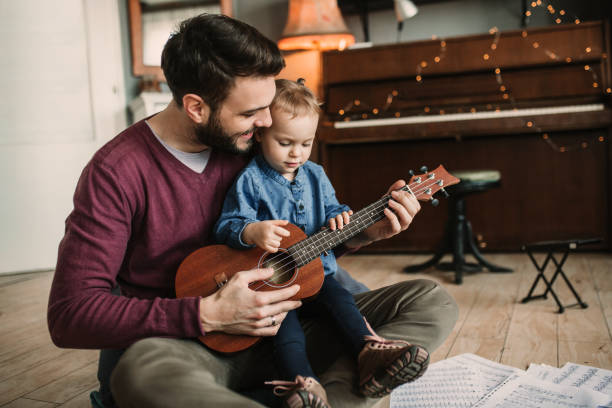istock Daughter and father playing guitars 923462806