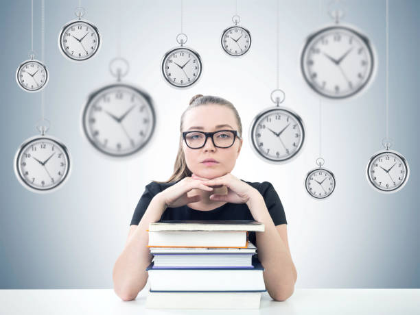 istock Serious blonde student, books, time management 923466312