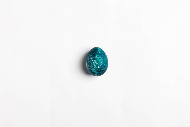 istock Easter egg isolated painted by hand in blue color on white background 923466858