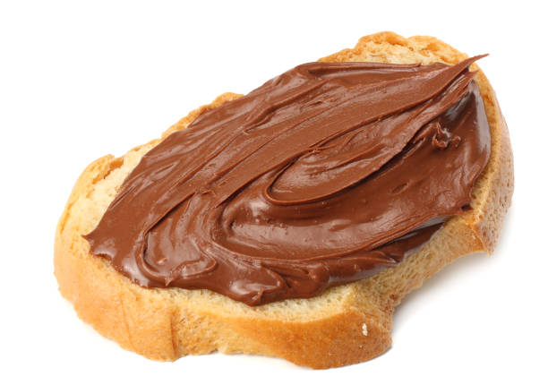 istock Slice of bread with chocolate cream isolated on white background 923473556