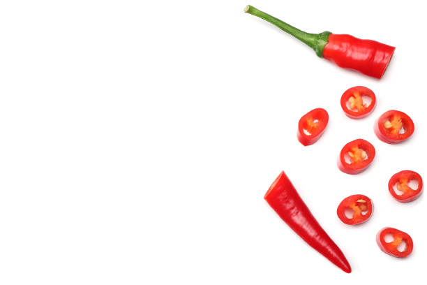istock sliced red hot chili peppers isolated on white background top view 923473596