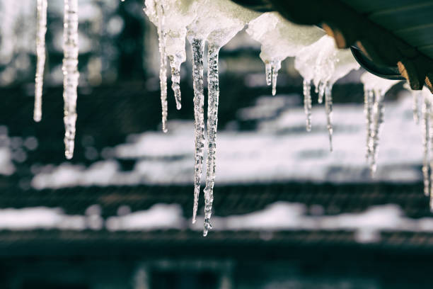 istock Crystal winter icicles under house 923478874