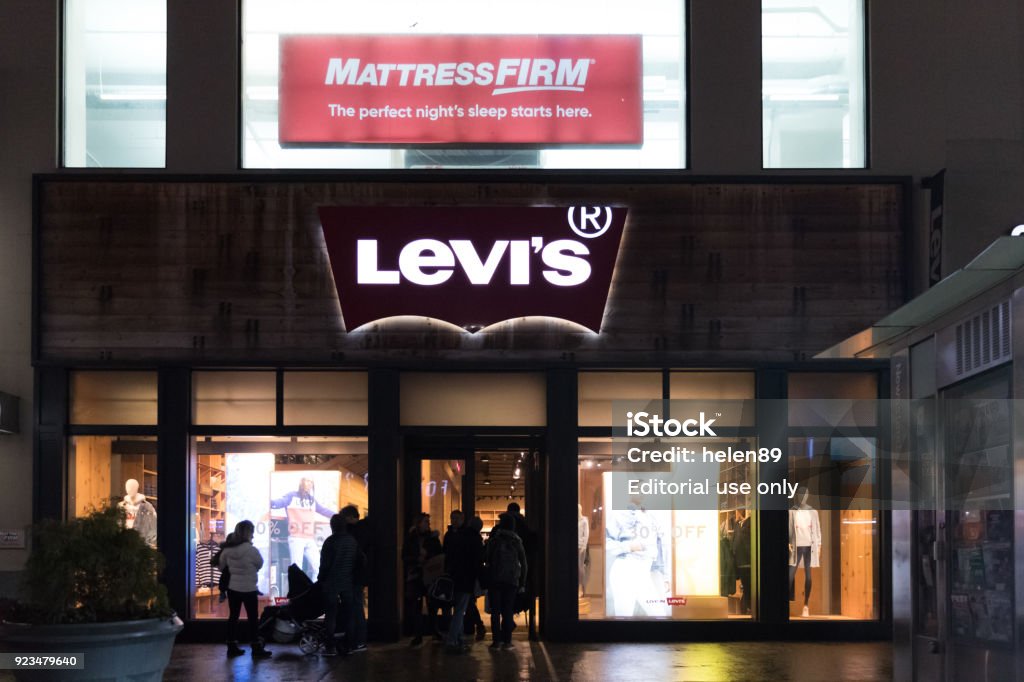 Shoppers Walk Past A Levis Retail Clothing Store In New York City Levi  Strauss Co Is A Privately Held American Clothing Company Stock Photo -  Download Image Now - iStock