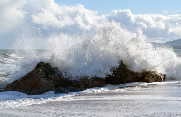 Waves crashing onto rocks. stock photo