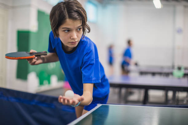istock Cute girl playing table tennis 923485420
