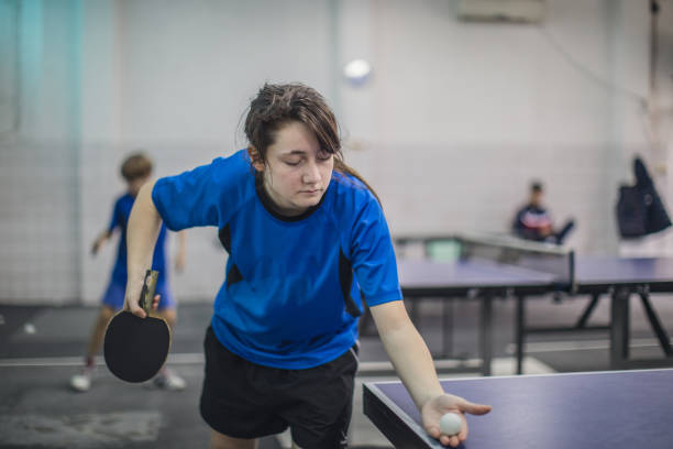 istock Young girl playing ping pong 923485498