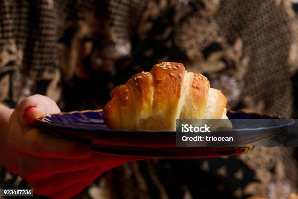 Woman Eating Croissant Stock Photo - Download Image Now - Adult, Adults Only, Baked