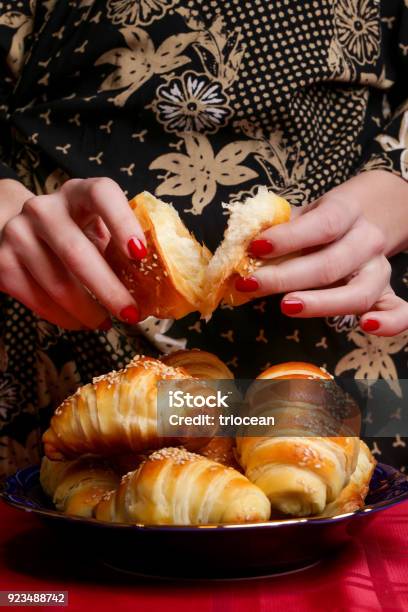 Woman Eating Croissant Stock Photo - Download Image Now - Adult, Adults Only, Baked