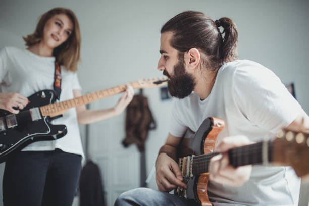 istock Couple playing electric guitar together 923488954