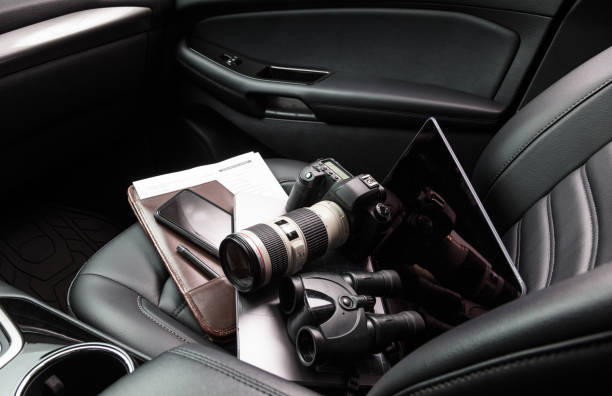 istock Private investigator tools on car seat 923491304