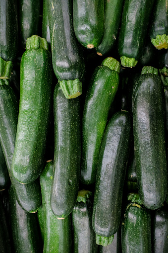 A pile of fresh harvested zucchini found that the farmers market