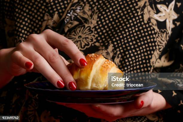 Woman Eating Croissant Stock Photo - Download Image Now - Adult, Adults Only, Baked