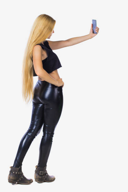istock back view of standing young beautiful  girl with tablet computer 923494760