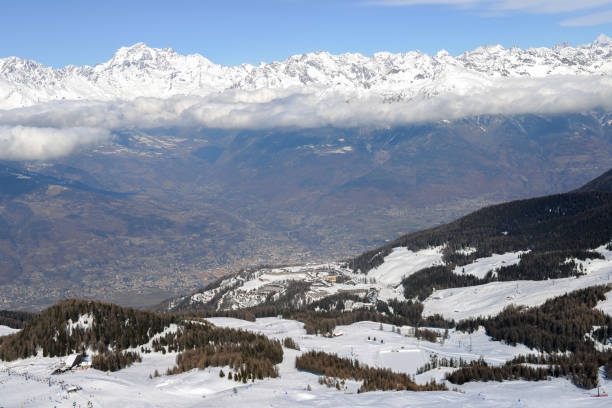 Aerial view of northern Italian city of Aosta and surrounding Valle d'Aosta from Pila ski resort Aerial view of northern Italian city of Aosta and surrounding Valle d'Aosta from Pila ski resort - chairlifts and ski runs pila stock pictures, royalty-free photos & images