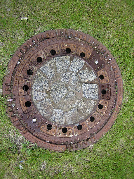 istock manhole/canal cover on green 92349738