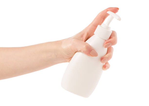 istock White soap bottle with dispenser in hand 923497686