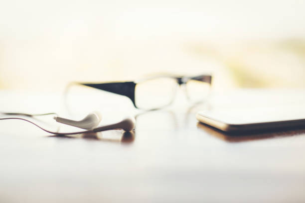 istock Blurry headphones, smartphone and glasses 923498226