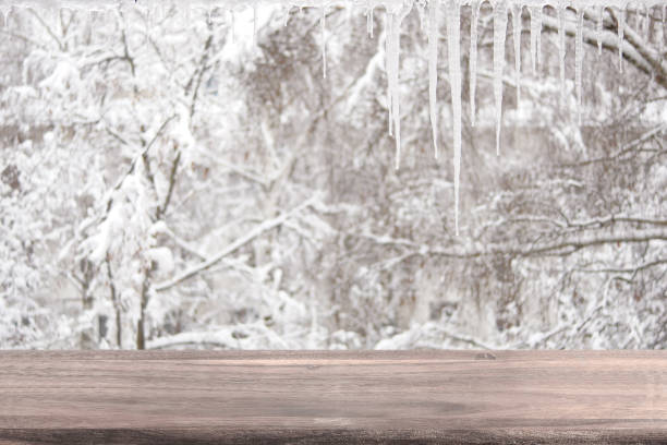 istock Empty wooden table on a background of a winter landscape. 923498812