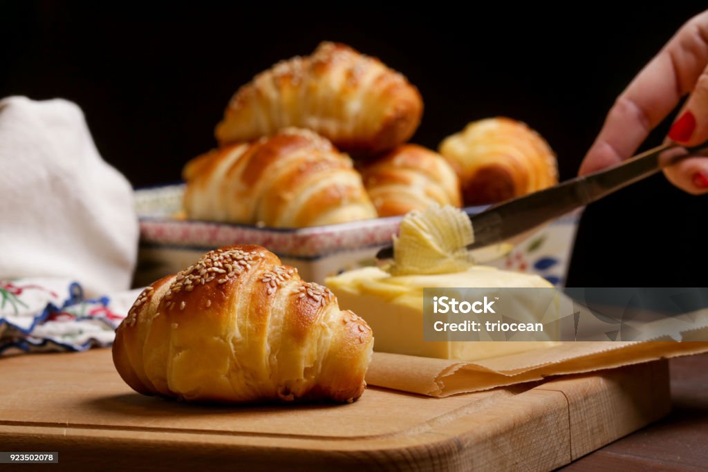 Freshly baked croissants and butter on the table Baked Stock Photo