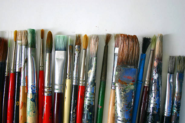 istock lots of paint brushes lined up 92350352