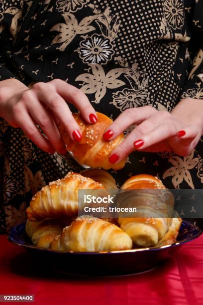 Woman Eating Croissant Stock Photo - Download Image Now - Adult, Adults Only, Baked