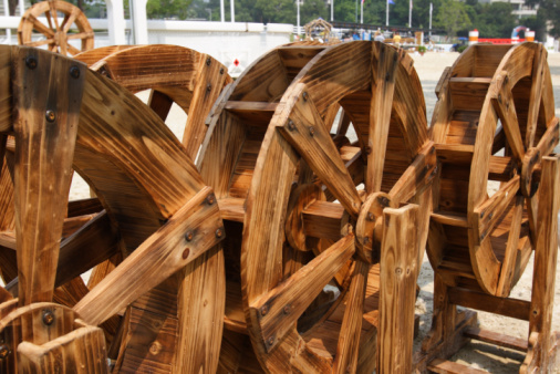 an old wooden wheel with a forged metal lining