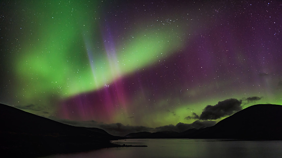 Aurora Borealis over loch Glascarnoch, by Garve, in the Highlands of Scotland