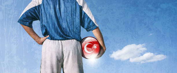 istock Turkey soccer player holding ball with turkish flag 923511986