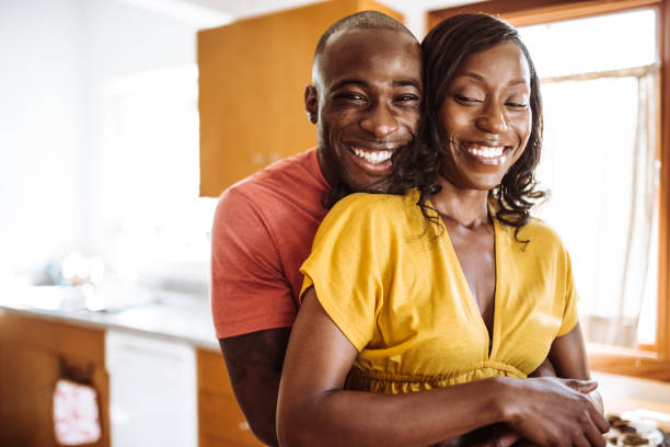istock couple embracing in the kitchen 923515738
