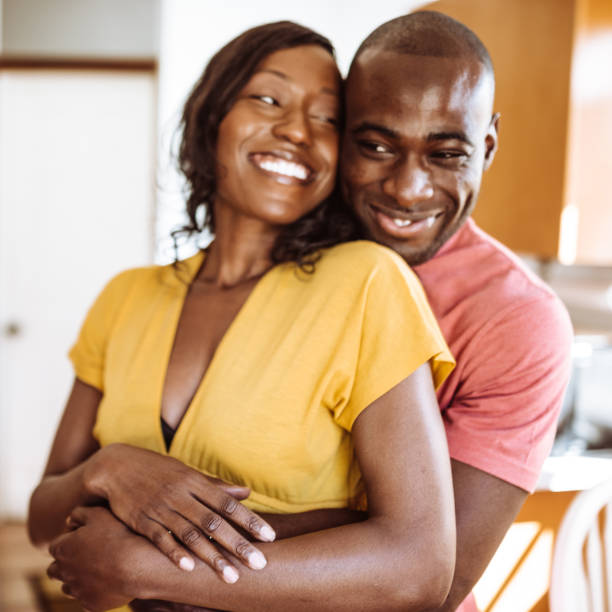 istock couple embracing in the kitchen 923515768
