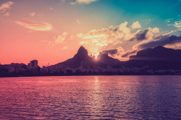 istock Sunset over mountains in Rio de Janeiro with light leak, Brazil 923516036