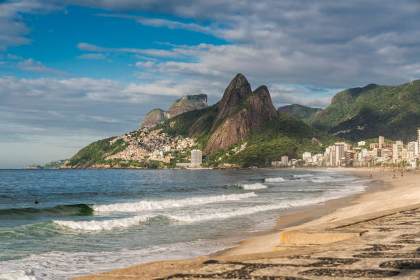 ipanema beach with two irmaos mountains. early morning light. rio de janeiro - rio de janeiro copacabana beach ipanema beach brazil imagens e fotografias de stock